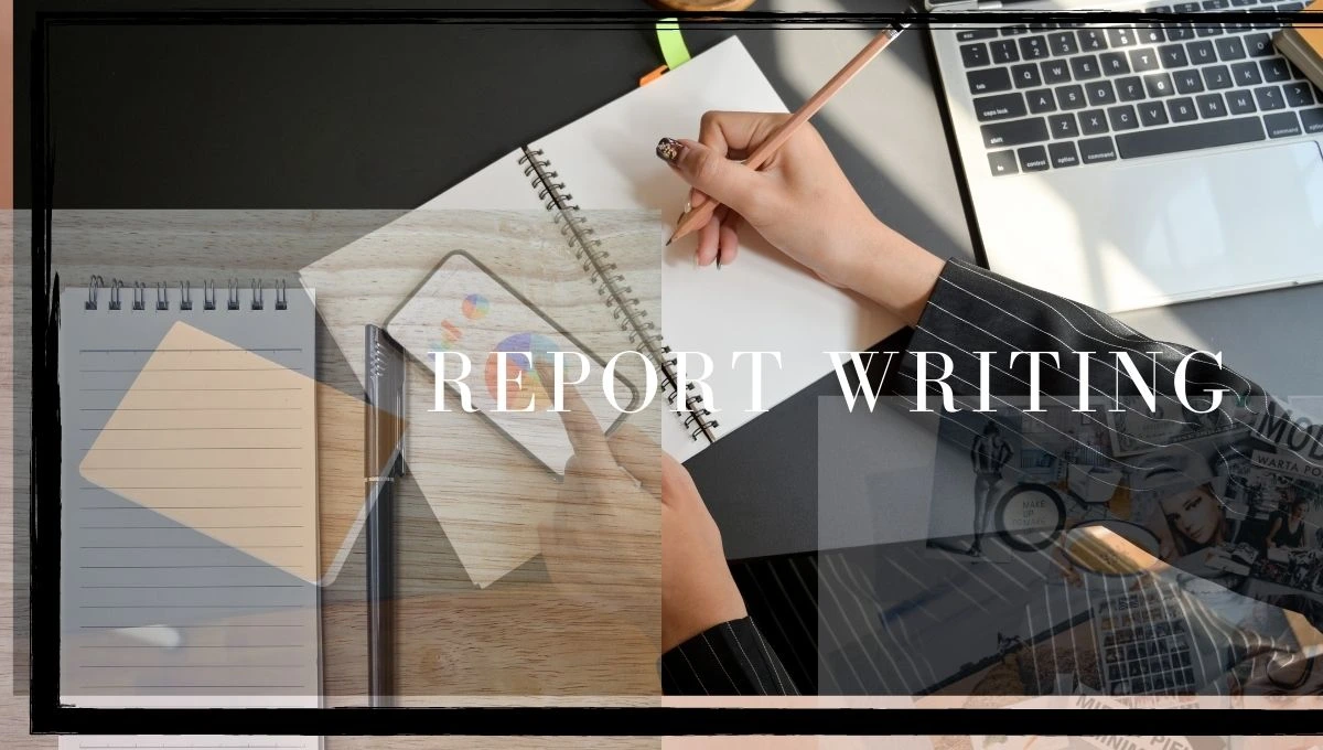 a person writing a report on a laptop computer